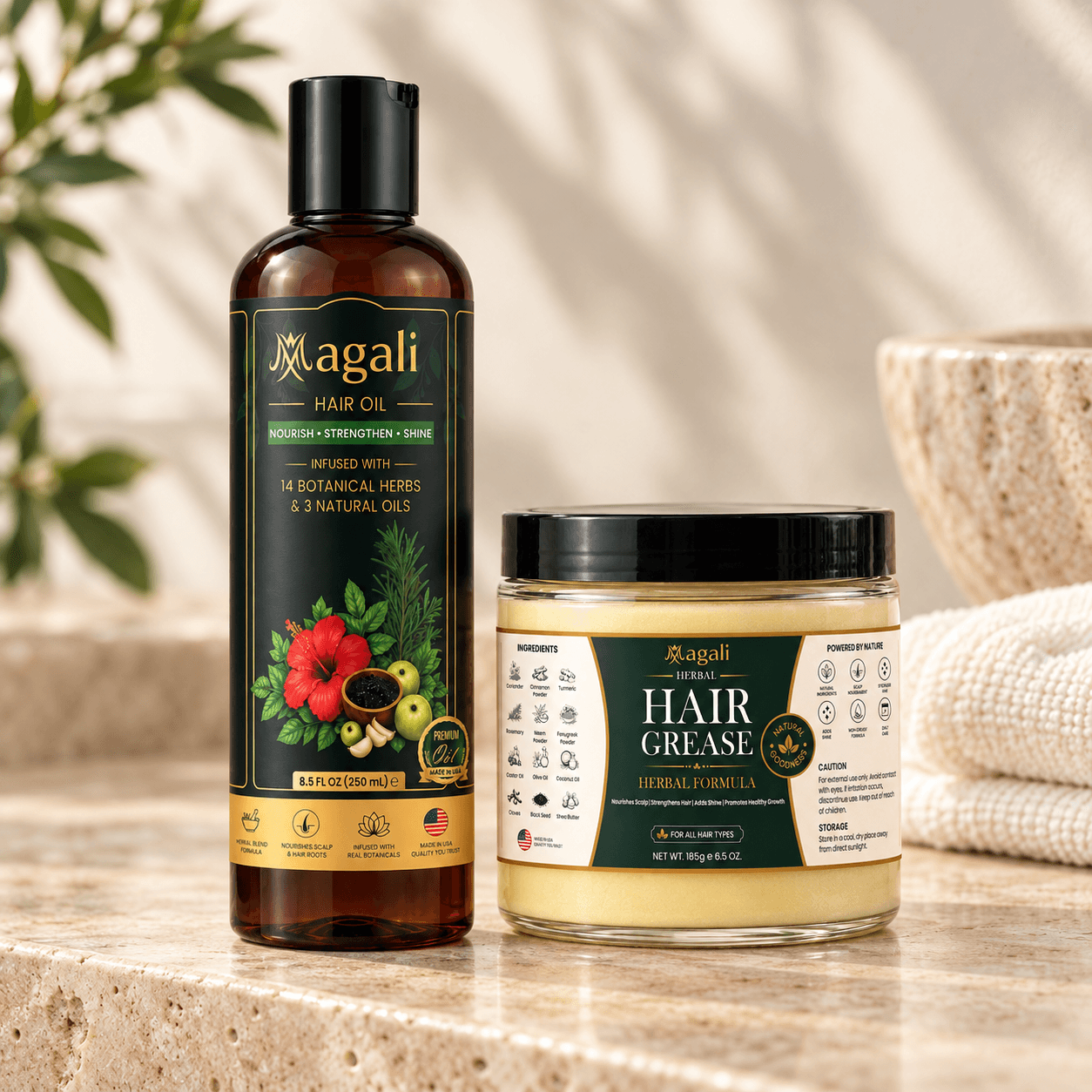 Magali Nourish & Shine Duo: 1 hair oil bottle and 1 hair grease jar on a warm stone bathroom counter